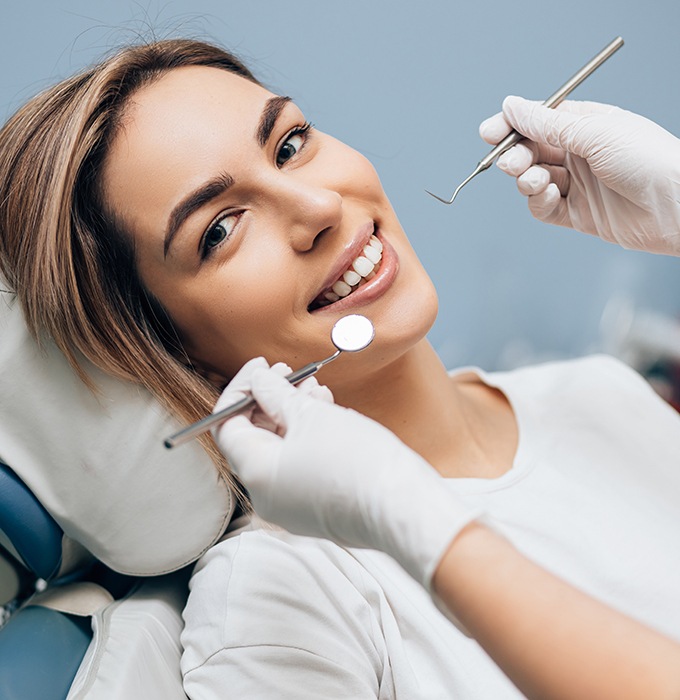 A dental exam and cleaning in Lansing, MI