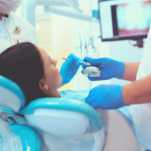 dentist treats patient